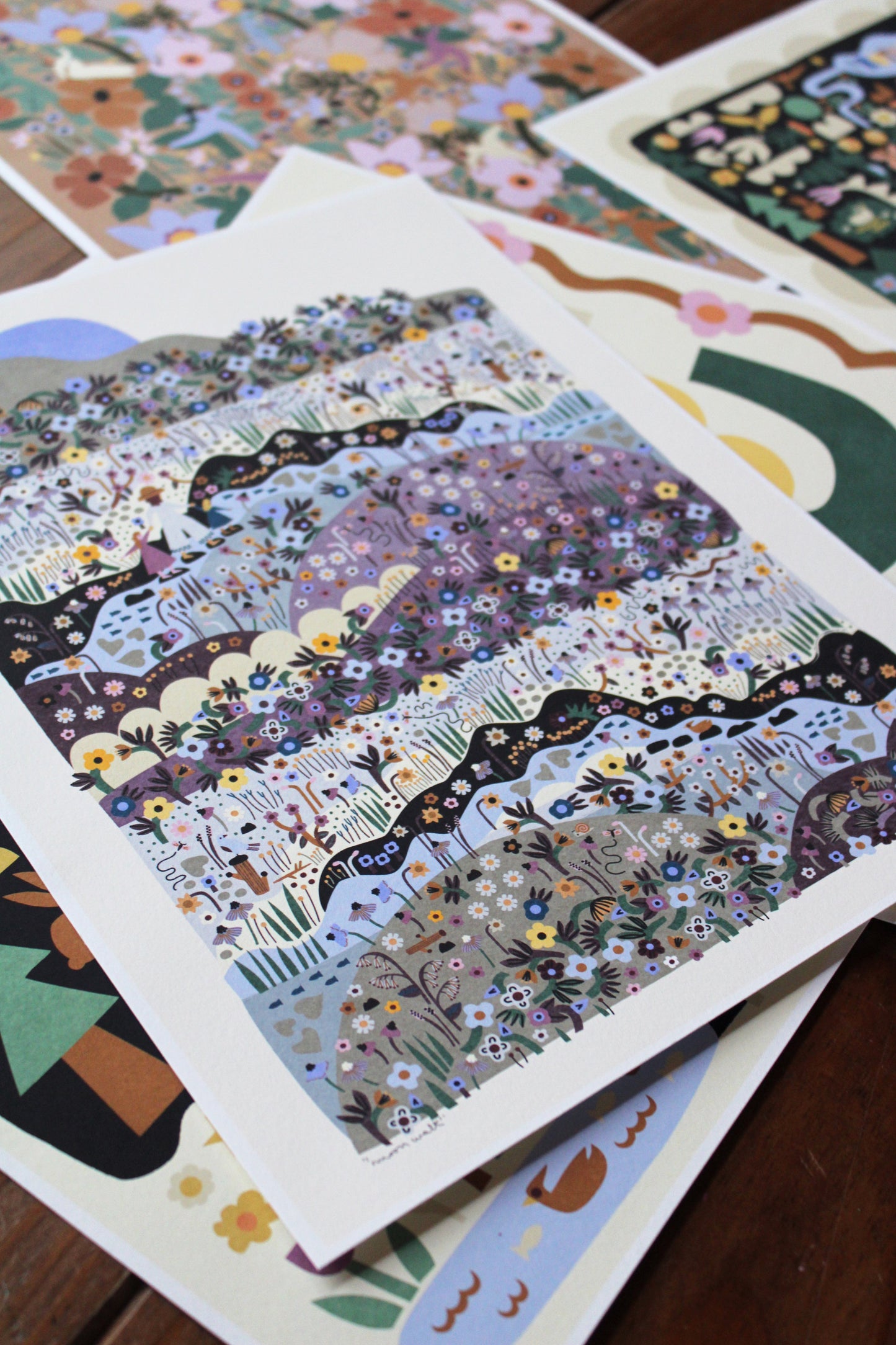 pile of art prints with beautiful illustrations