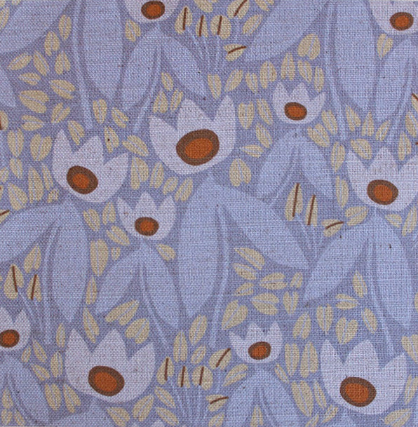 Patterned fabric with stylized flowers on a blue background