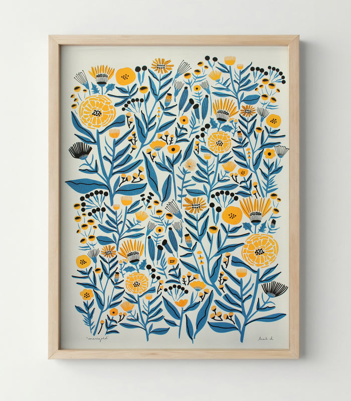 Framed risograph print of blue and golden yellow marigold flowers on creamy off-white paper by Woolly Press